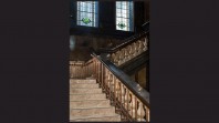 marble staircase with stained-glass windows