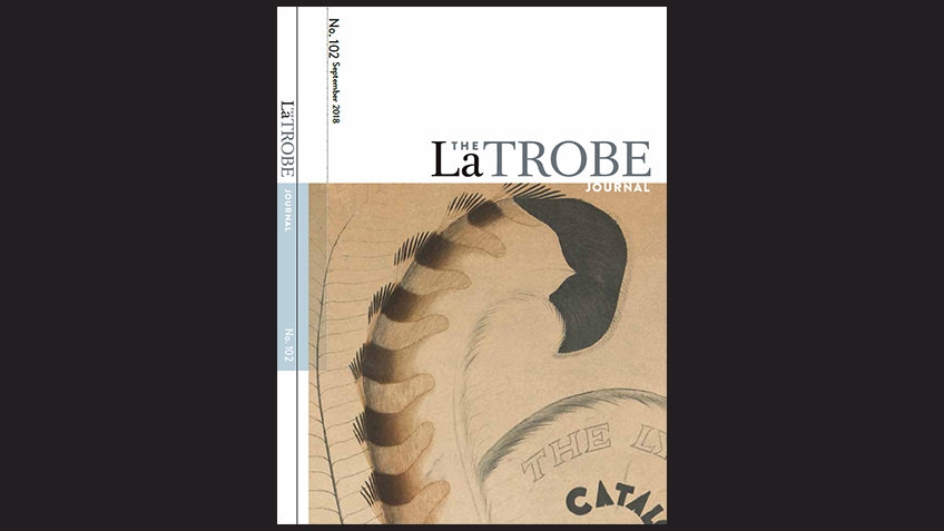 black background with journal cover, black text on white and sepia image of lyrebird feather