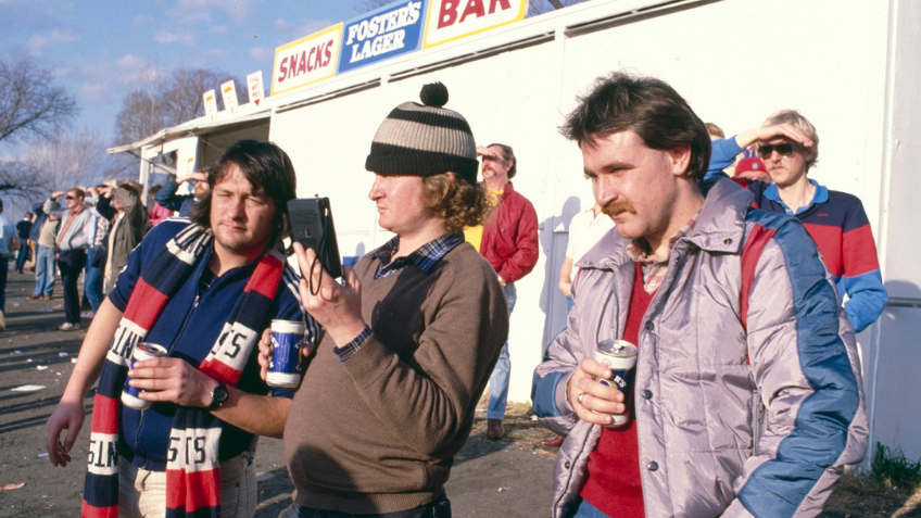 A crowd of onlookers at a football game