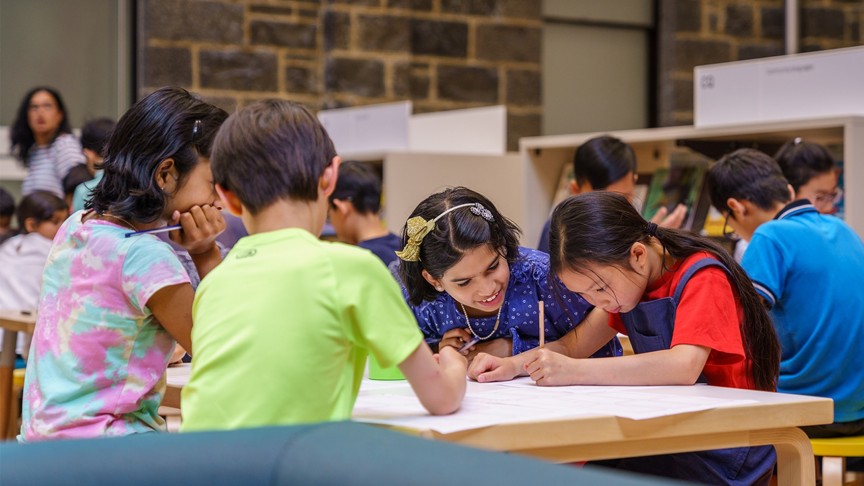children working at desk