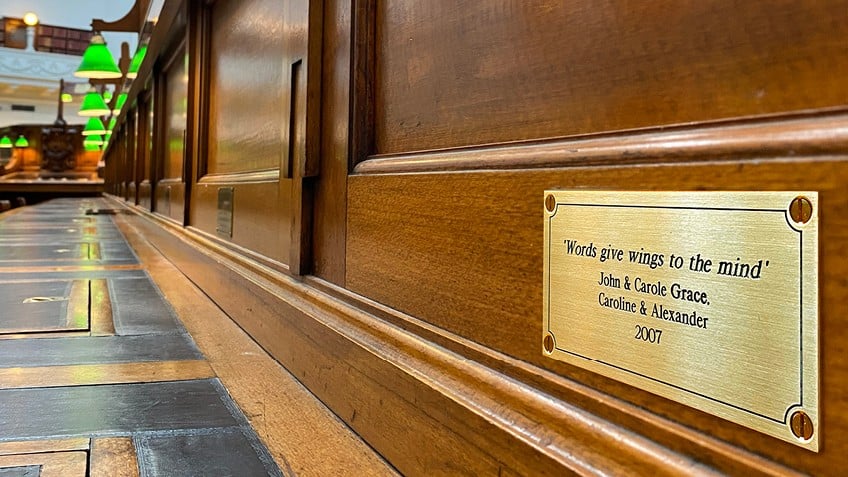 A commemorative plaque in the State Library Victoria reading room