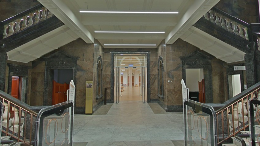 A marble foyer opens onto an interior space