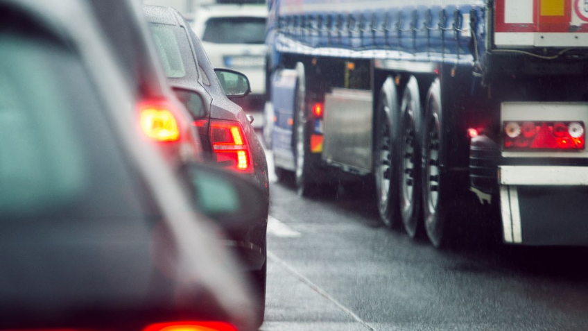 Close up on cars and trucks on a busy road